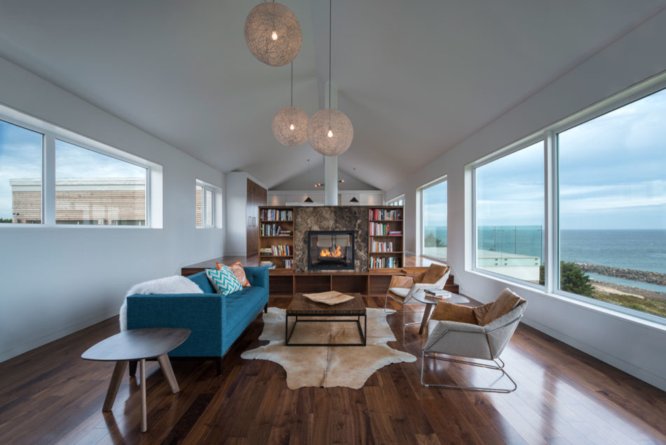 Living room - mid-sized 1960s formal and open concept medium tone wood floor and brown floor living room idea in Other with white walls, a two-sided fireplace, a tile fireplace and no tv