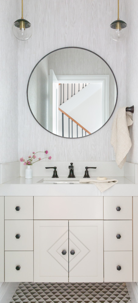 Inspiration for a small transitional powder room in San Francisco with flat-panel cabinets, beige cabinets, grey walls, an undermount sink, multi-coloured floor, beige benchtops and a floating vanity.