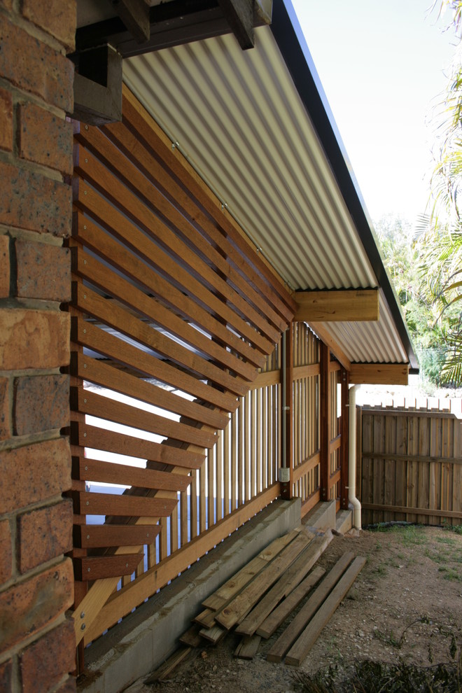 Photo of a mid-sized contemporary detached two-car garage in Brisbane.