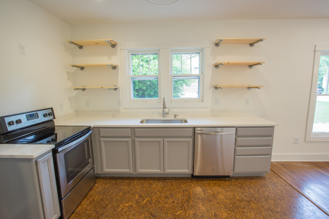 Kitchen In Ice Quartz Countertops With Grey Cabinets And Open