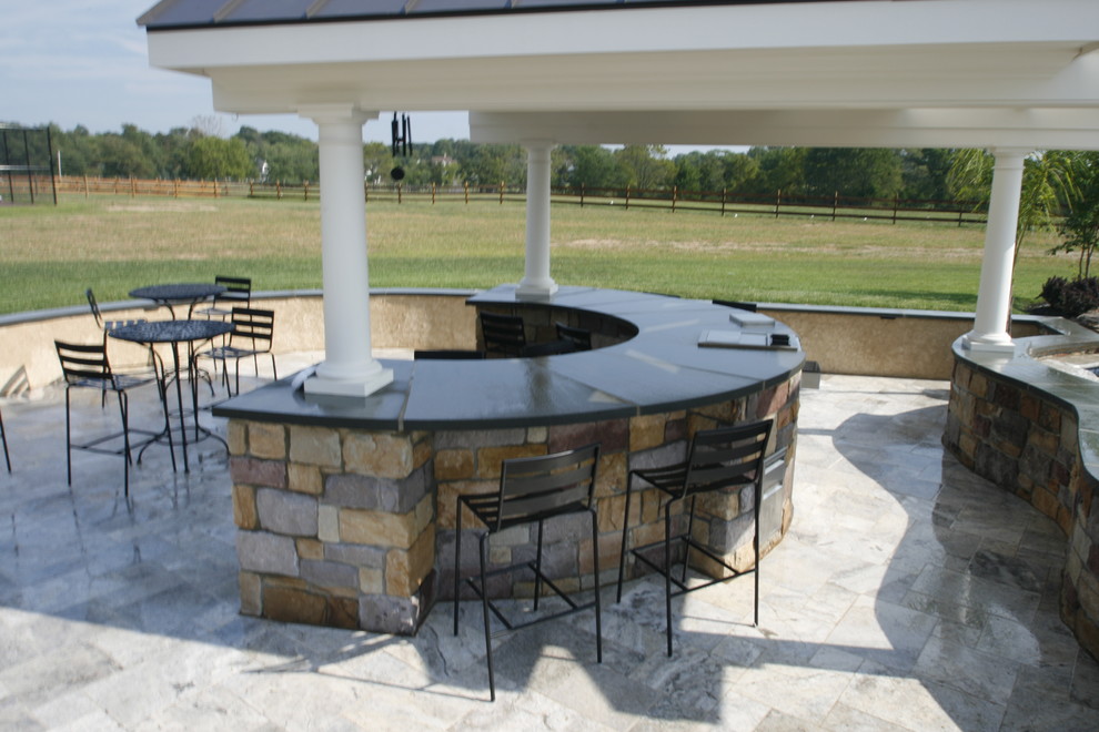 Design ideas for an expansive modern backyard patio in Philadelphia with a water feature and decomposed granite.