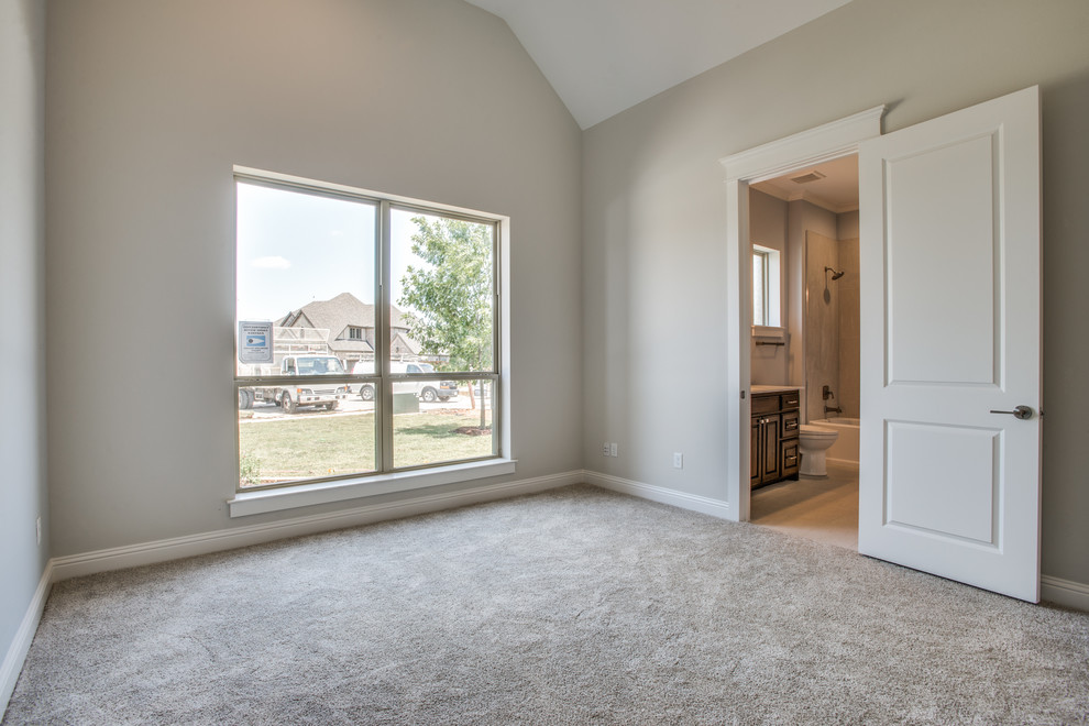 Example of a mid-sized transitional master carpeted bedroom design in Dallas with beige walls