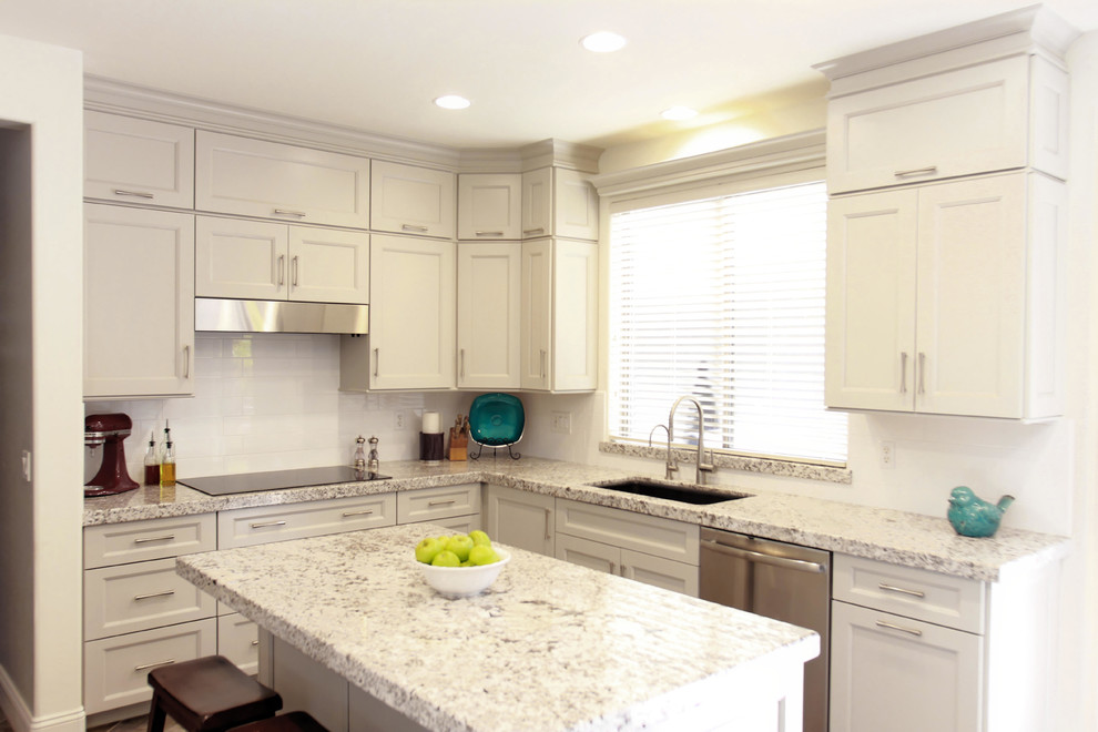 Mid-sized transitional u-shaped porcelain tile and gray floor eat-in kitchen photo in Phoenix with a double-bowl sink, shaker cabinets, gray cabinets, granite countertops, white backsplash, subway tile backsplash, stainless steel appliances, an island and white countertops