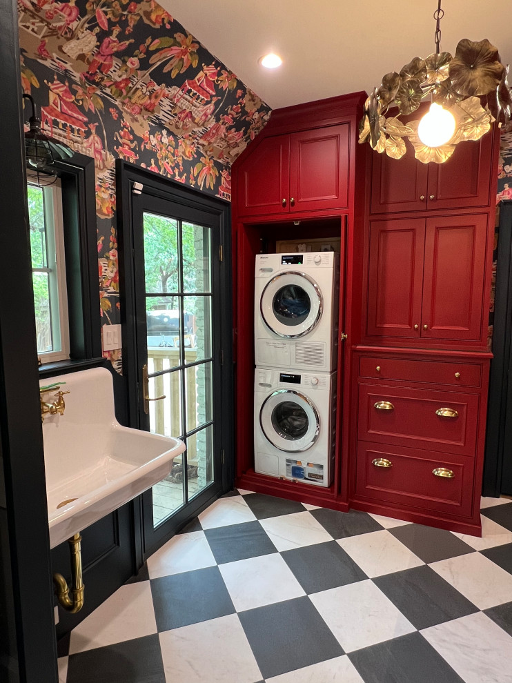 Inspiration for a mid-sized timeless utility room remodel with red cabinets and a stacked washer/dryer