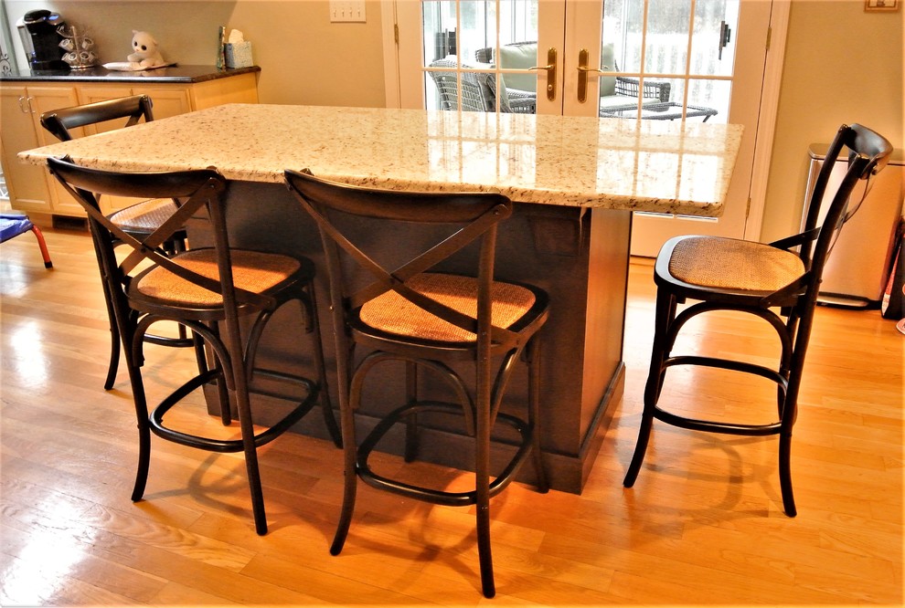 Transitional light wood floor eat-in kitchen photo in Boston with granite countertops and an island