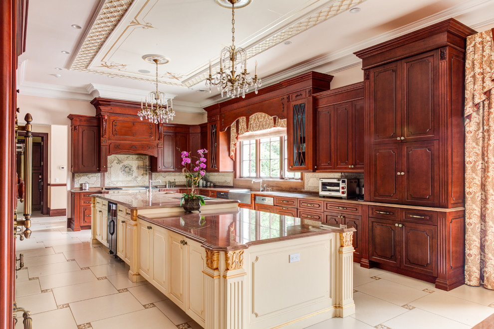 Inspiration for a huge victorian u-shaped ceramic tile and beige floor enclosed kitchen remodel in New York with a farmhouse sink, raised-panel cabinets, dark wood cabinets, granite countertops, beige backsplash, ceramic backsplash, paneled appliances, two islands and brown countertops