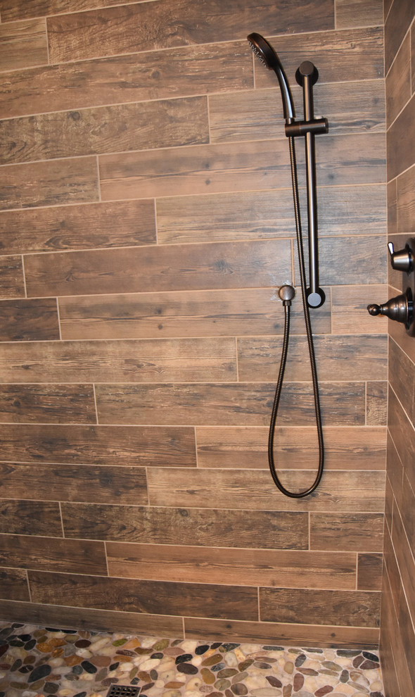 Mountain style pebble tile floor home design photo