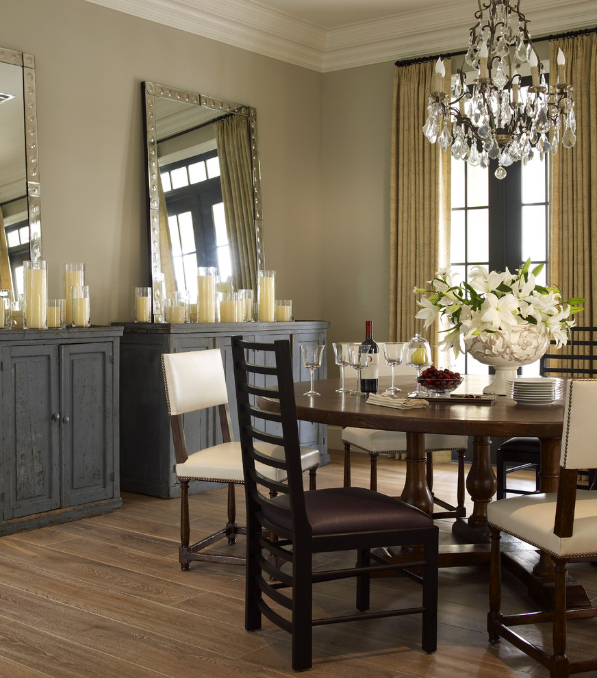 Inspiration for a transitional dining room in Houston with medium hardwood floors and beige walls.