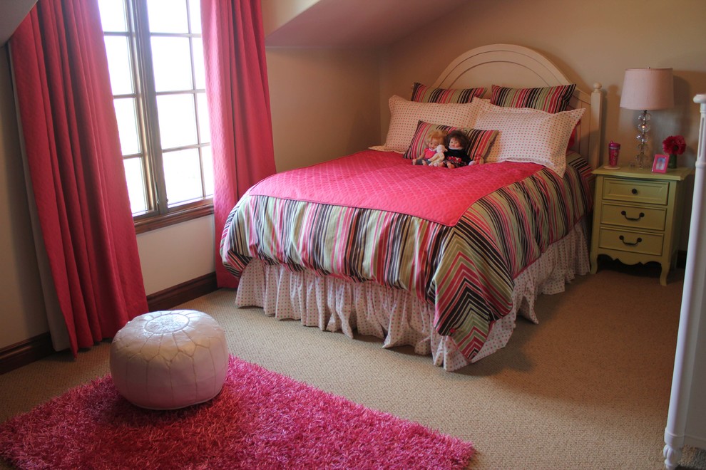Photo of an expansive transitional kids' bedroom for kids 4-10 years old and girls in Wichita with beige walls and carpet.