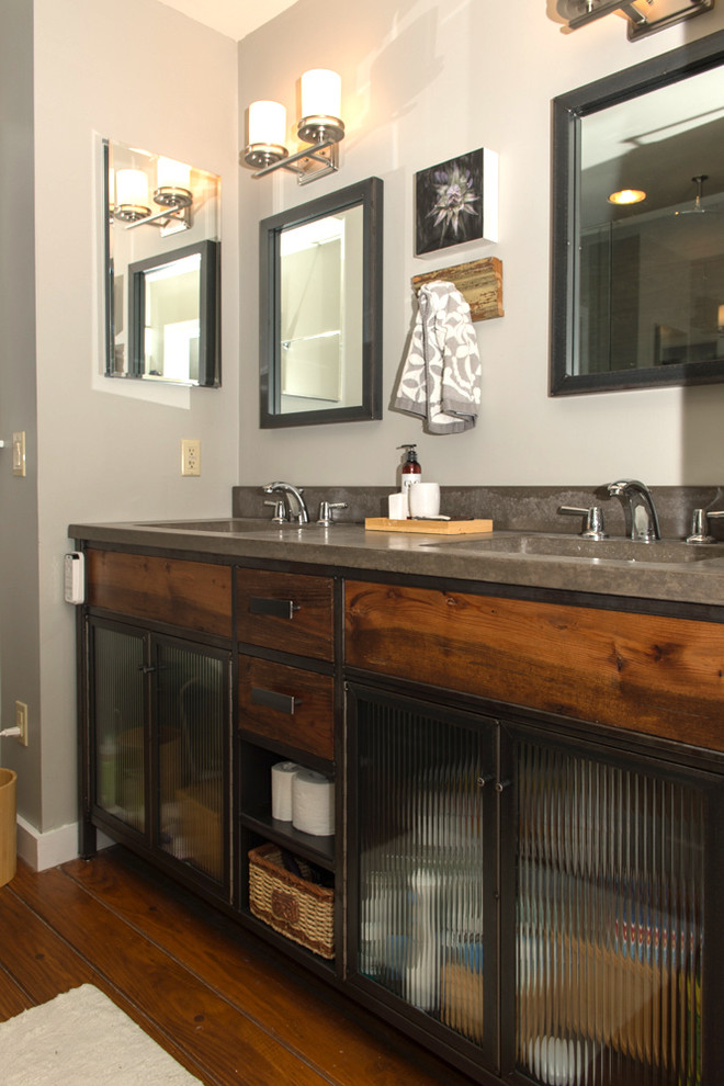 Eclectic bathroom in Other with distressed cabinets and concrete benchtops.