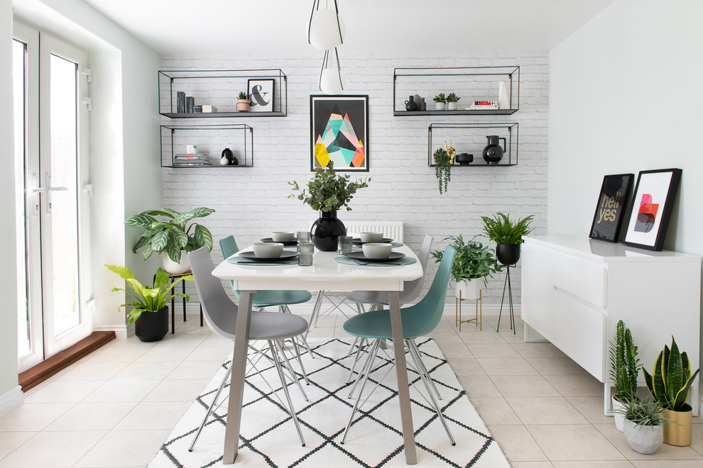 Photo of a medium sized scandinavian dining room with white walls, no fireplace and beige floors.