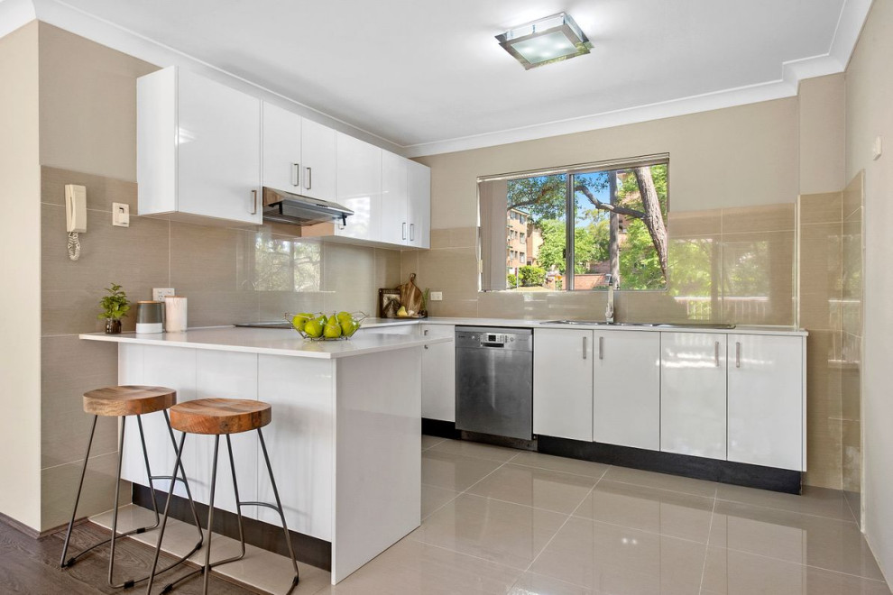 Inspiration for a mid-sized contemporary l-shaped kitchen in Sydney with with island.