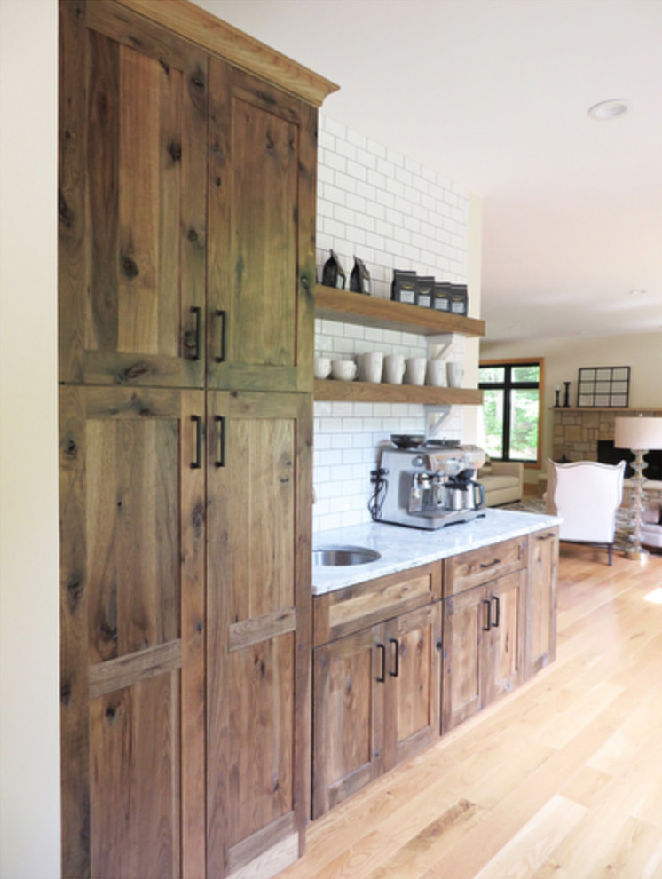 Example of a transitional kitchen design with beaded inset cabinets and medium tone wood cabinets