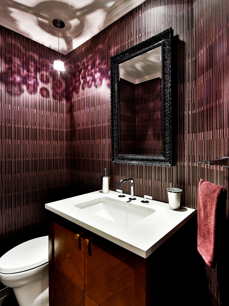 Inspiration for a small contemporary powder room in Montreal with an undermount sink, flat-panel cabinets, dark wood cabinets, engineered quartz benchtops, purple walls and a one-piece toilet.