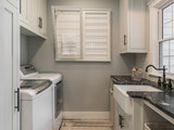 Farmhouse Laundry Room by CarsonSpeer Builders