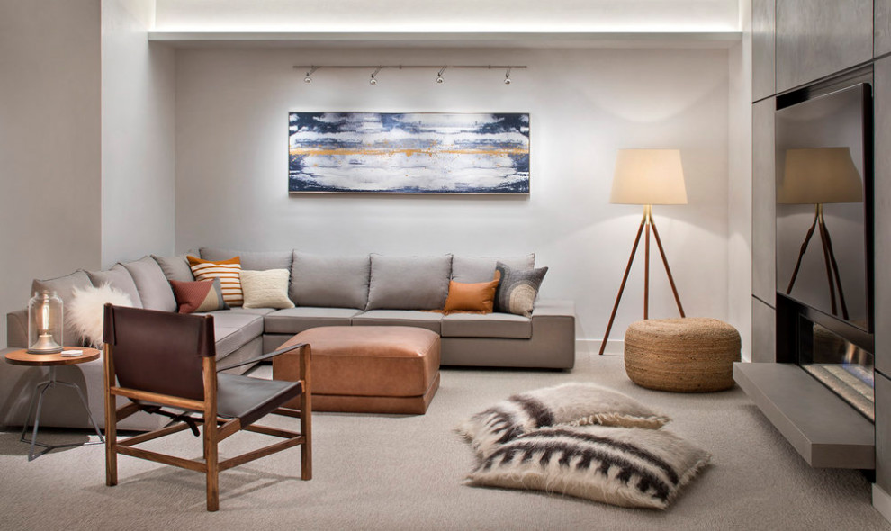 Ejemplo de sala de estar abierta actual de tamaño medio sin chimenea y televisor con paredes blancas y suelo de madera en tonos medios