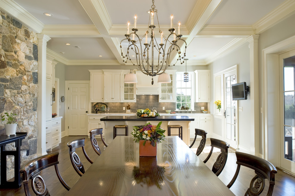 This is an example of a traditional kitchen/dining combo in Philadelphia with dark hardwood floors.