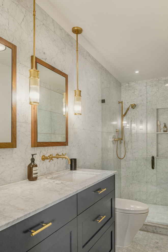 Design ideas for a mid-sized modern master bathroom in Seattle with an undermount sink, a hinged shower door, a one-piece toilet, gray tile, marble, mosaic tile floors, marble benchtops, grey benchtops, shaker cabinets, grey cabinets, an alcove shower, a double vanity and a built-in vanity.