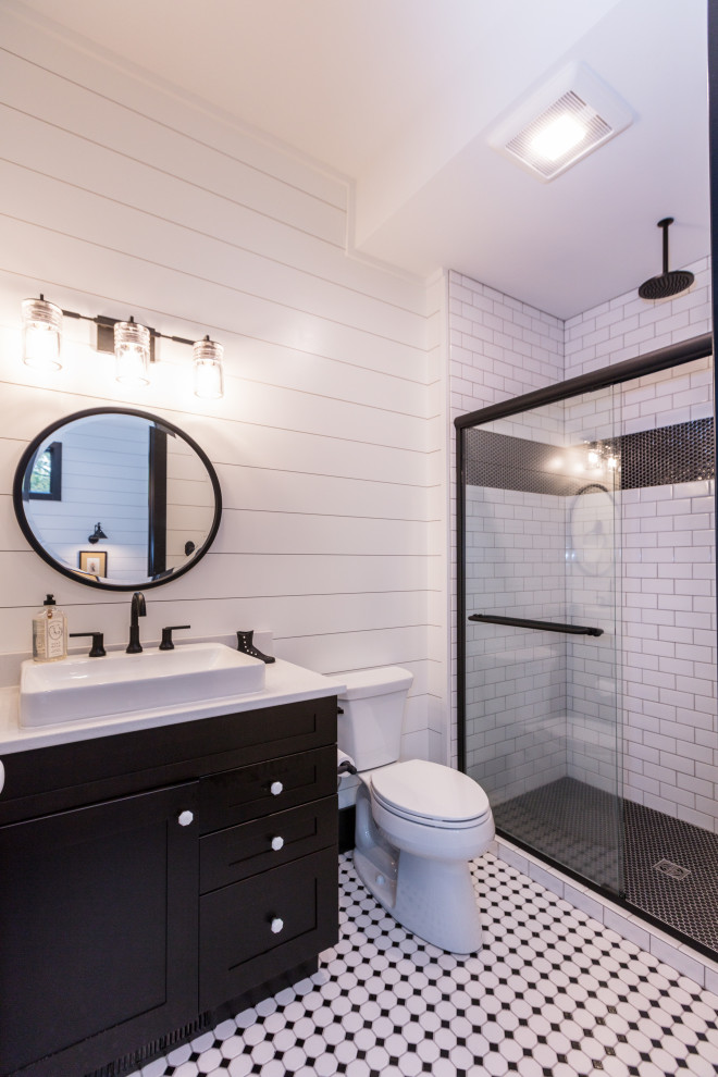 Inspiration for a small porcelain tile, shiplap wall and single-sink corner shower remodel in Other with a freestanding vanity, black cabinets, white walls, a console sink and white countertops
