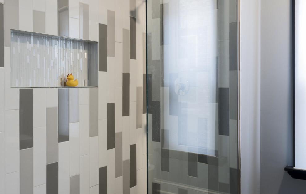 Design ideas for a modern bathroom in Chicago with a corner shower, multi-coloured tile and porcelain tile.