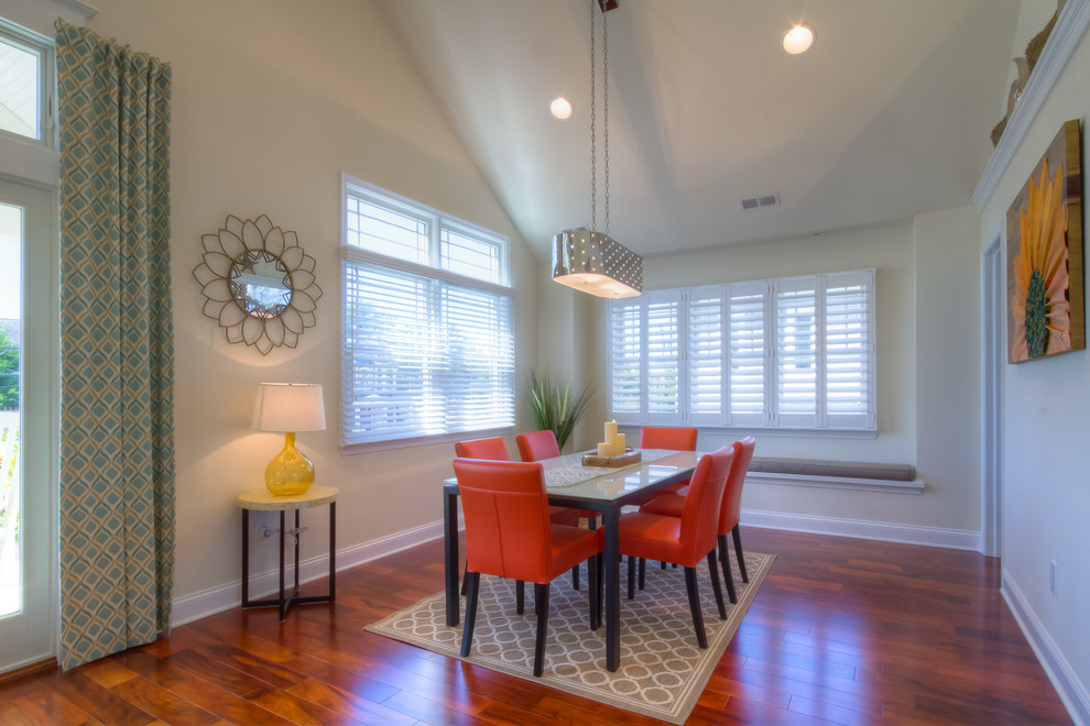 Photo of a beach style dining room in Philadelphia with white walls and dark hardwood floors.