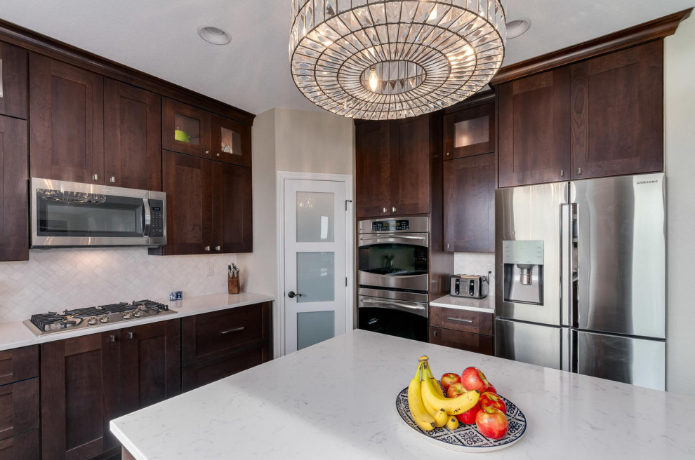 Example of a transitional kitchen design in Denver