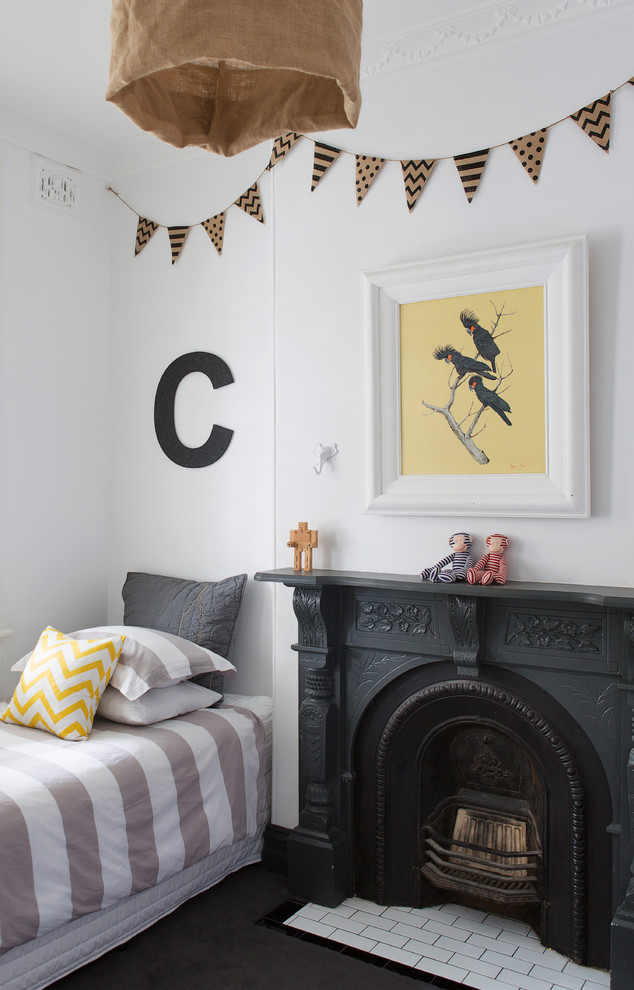 Photo of a transitional gender-neutral kids' bedroom in Sydney with white walls and dark hardwood floors.