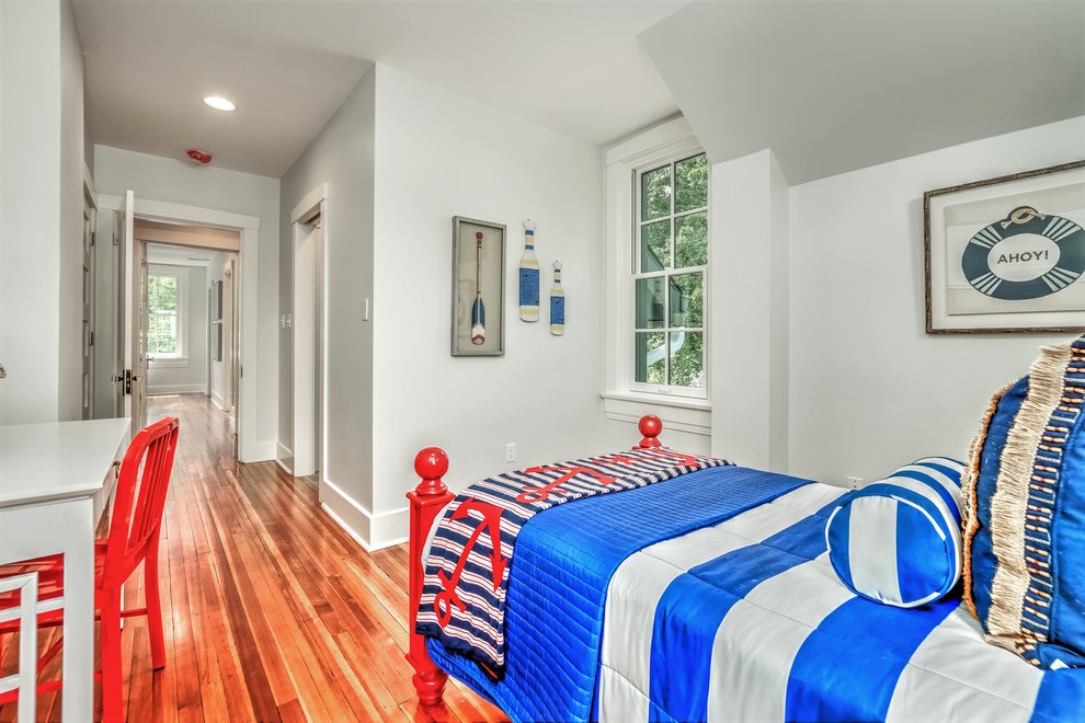 Inspiration for a mid-sized craftsman guest dark wood floor and brown floor bedroom remodel in St Louis with gray walls and no fireplace