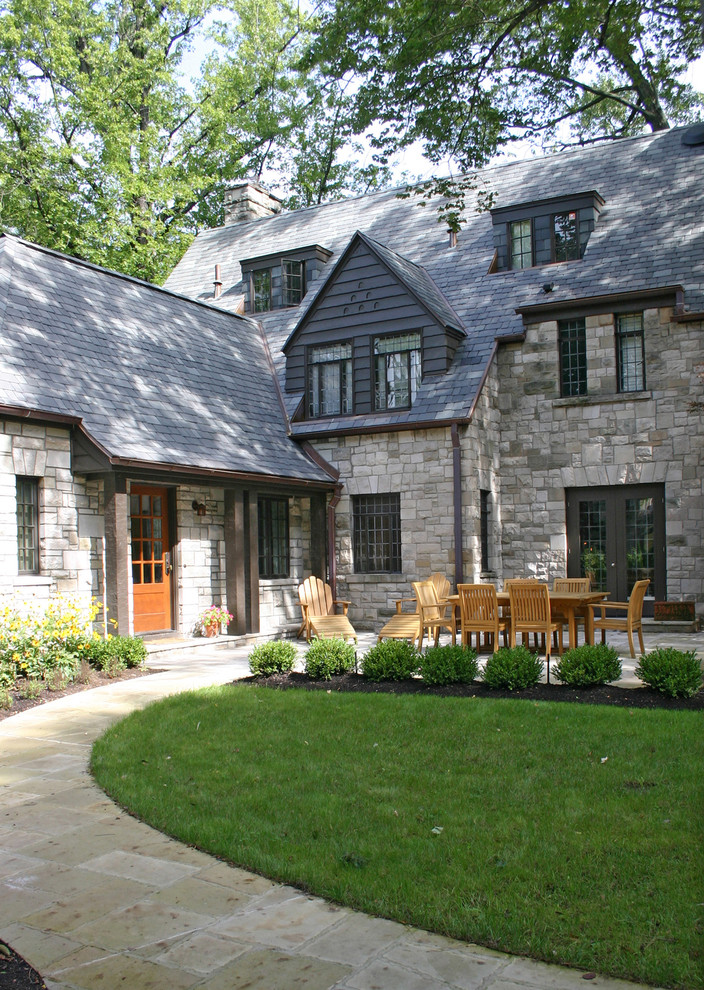 This is an example of a traditional exterior in Other with stone veneer.