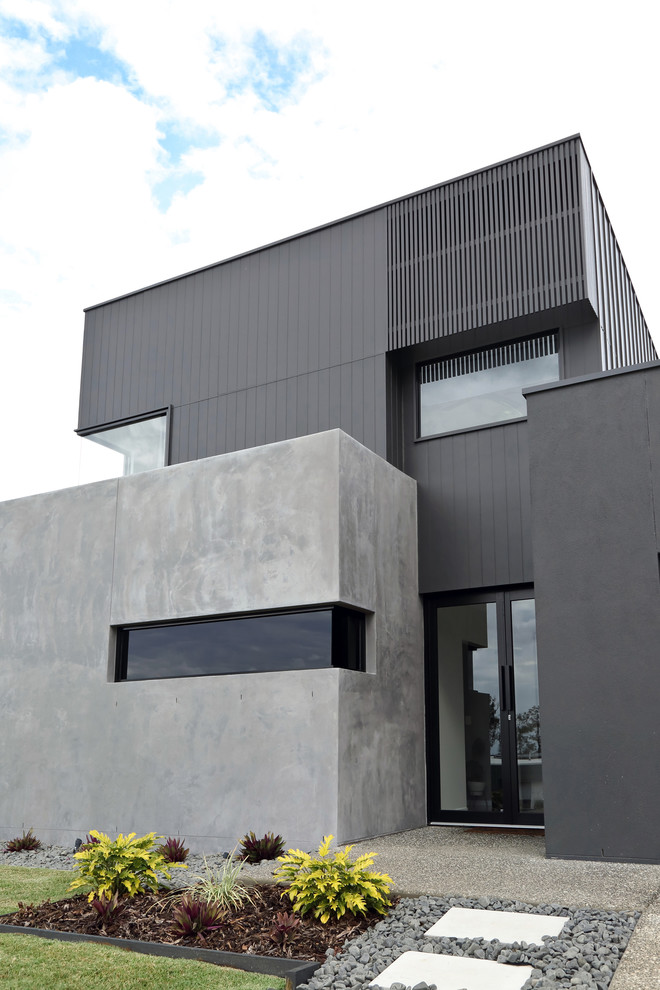 Design ideas for a contemporary two-storey house exterior in Sunshine Coast.