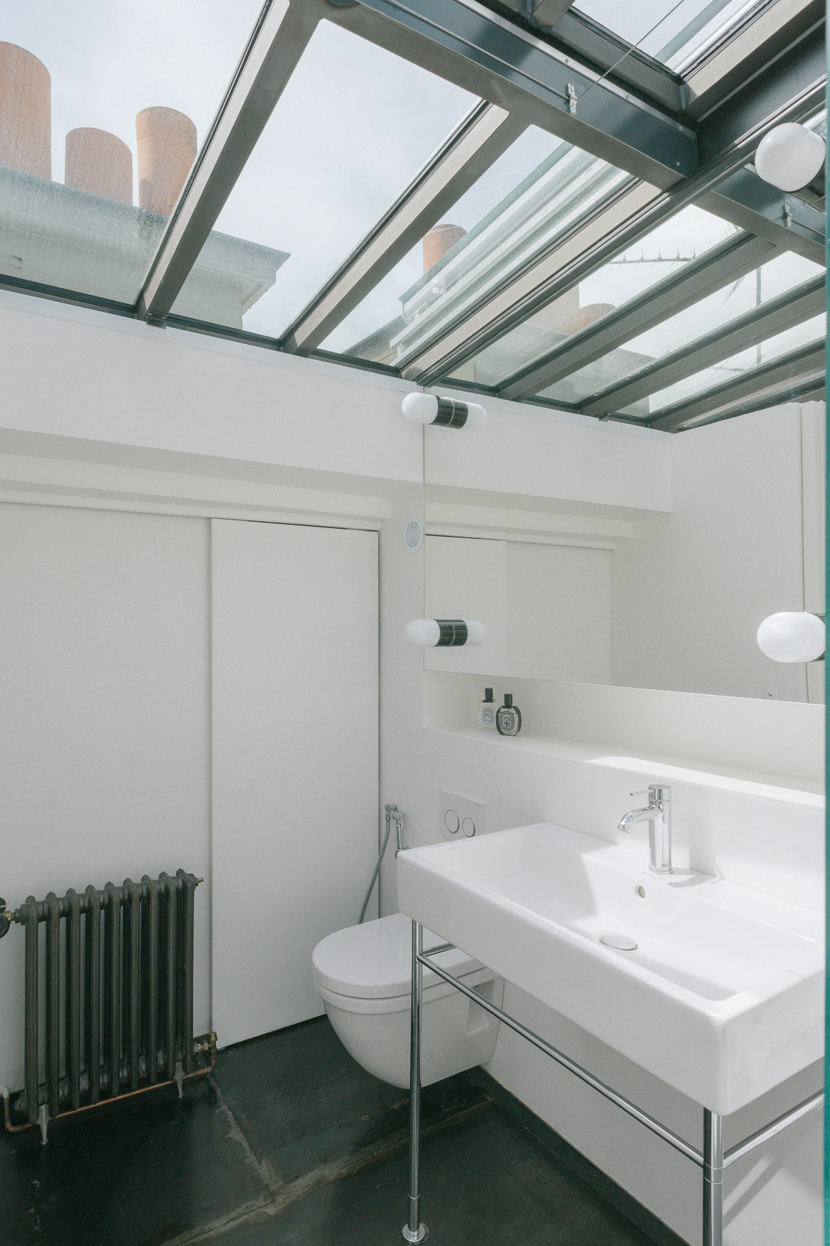 Réhabilitation d'un duplex esprit loft avec toit verrière coulissant