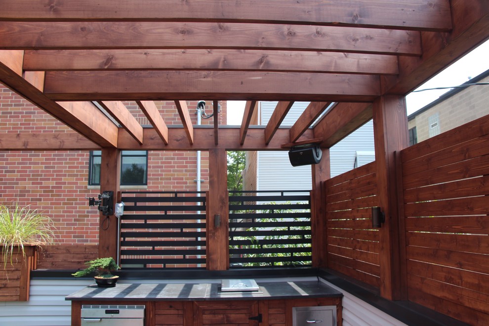 Mid-sized modern rooftop deck in Chicago with an outdoor kitchen and a pergola.