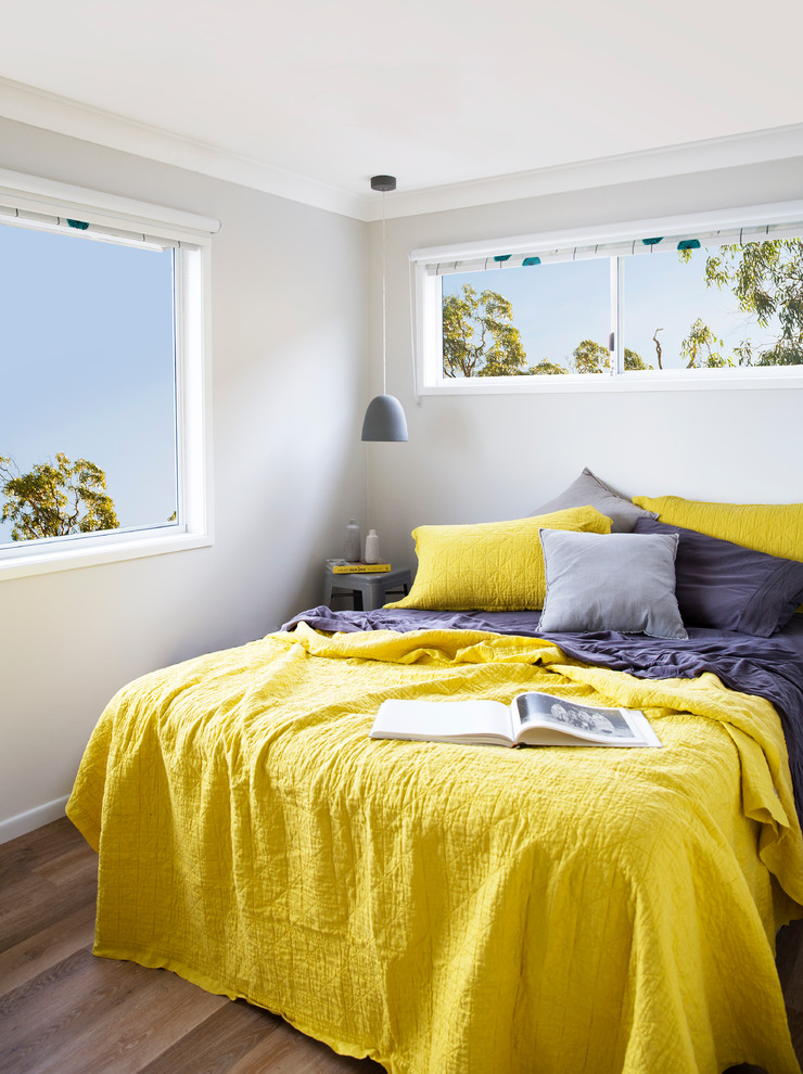 Photo of a mid-sized contemporary guest bedroom in Gold Coast - Tweed with grey walls and vinyl floors.