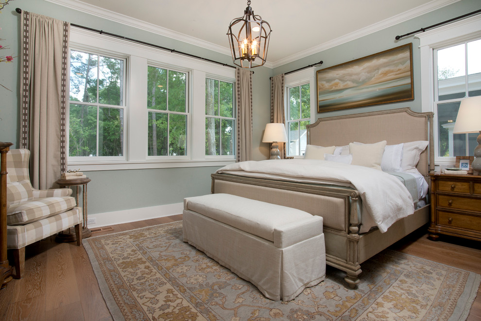 Inspiration for a beach style bedroom in Atlanta with blue walls and dark hardwood floors.