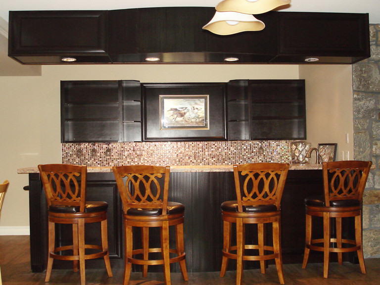 Inspiration for a large contemporary seated home bar remodel in Vancouver with dark wood cabinets