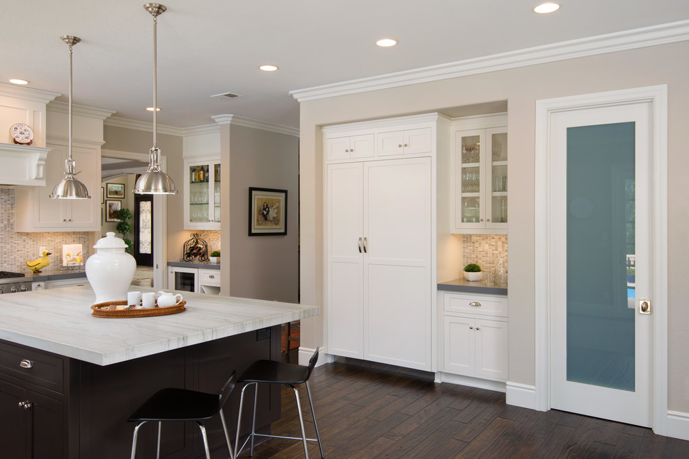 Design ideas for a traditional kitchen in San Diego with recessed-panel cabinets, white cabinets, granite benchtops, white appliances, dark hardwood floors and with island.