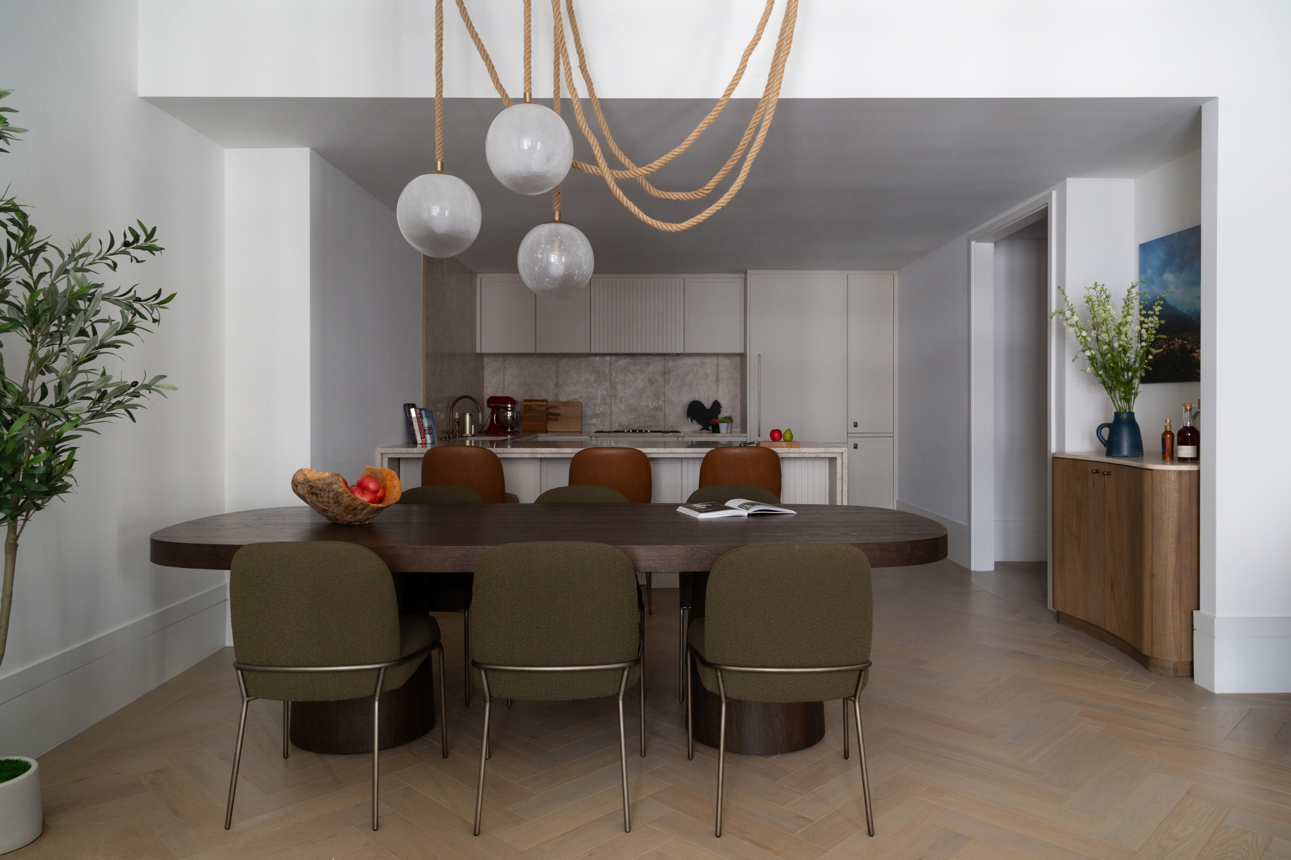 contemporary dining area with olive green chairs