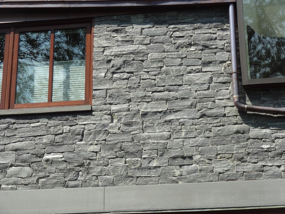 Traditional Newton Home with Greenwich Gray Stacked Stone