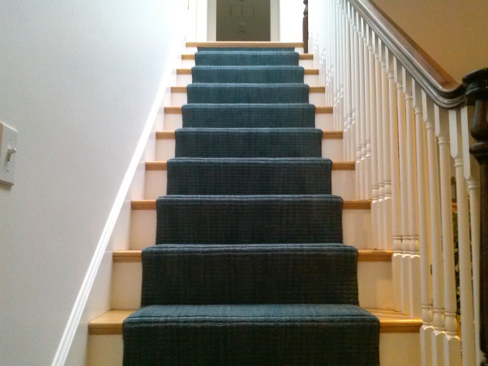 Design ideas for a mid-sized transitional carpeted straight staircase in Boston with carpet risers.