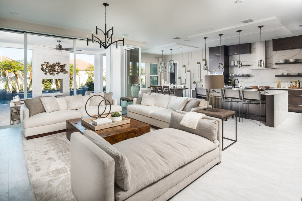 Design ideas for a transitional open concept living room in San Diego with grey floor.