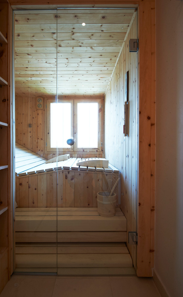 This is an example of a traditional bathroom in Other with beige walls and with a sauna.