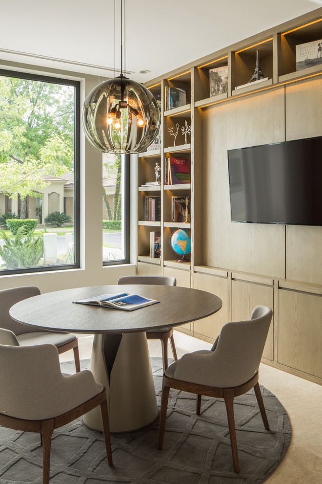 Contemporary dining room in Other with beige walls and carpet.