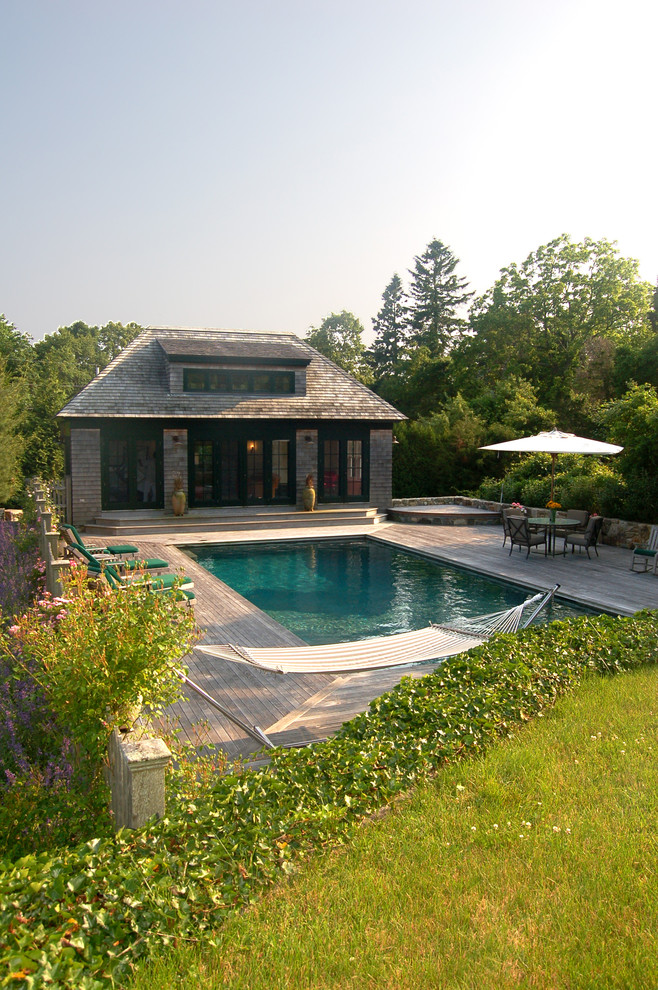 Design ideas for a traditional rectangular pool in Providence with decking and a pool house.