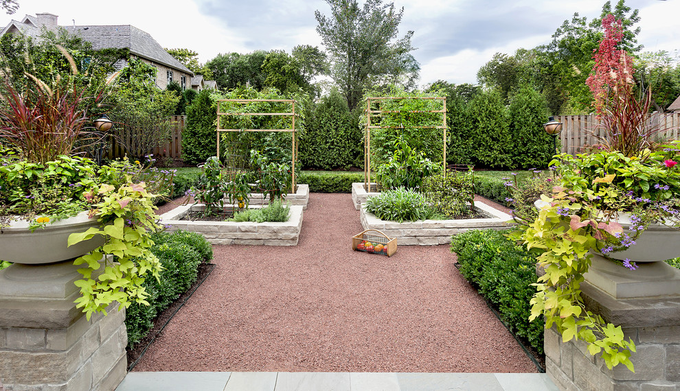 Photo of a traditional backyard full sun formal garden in Chicago with a vegetable garden and gravel.