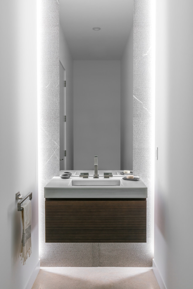 Small contemporary powder room in Tampa with flat-panel cabinets, brown cabinets, white walls, an undermount sink and beige floor.