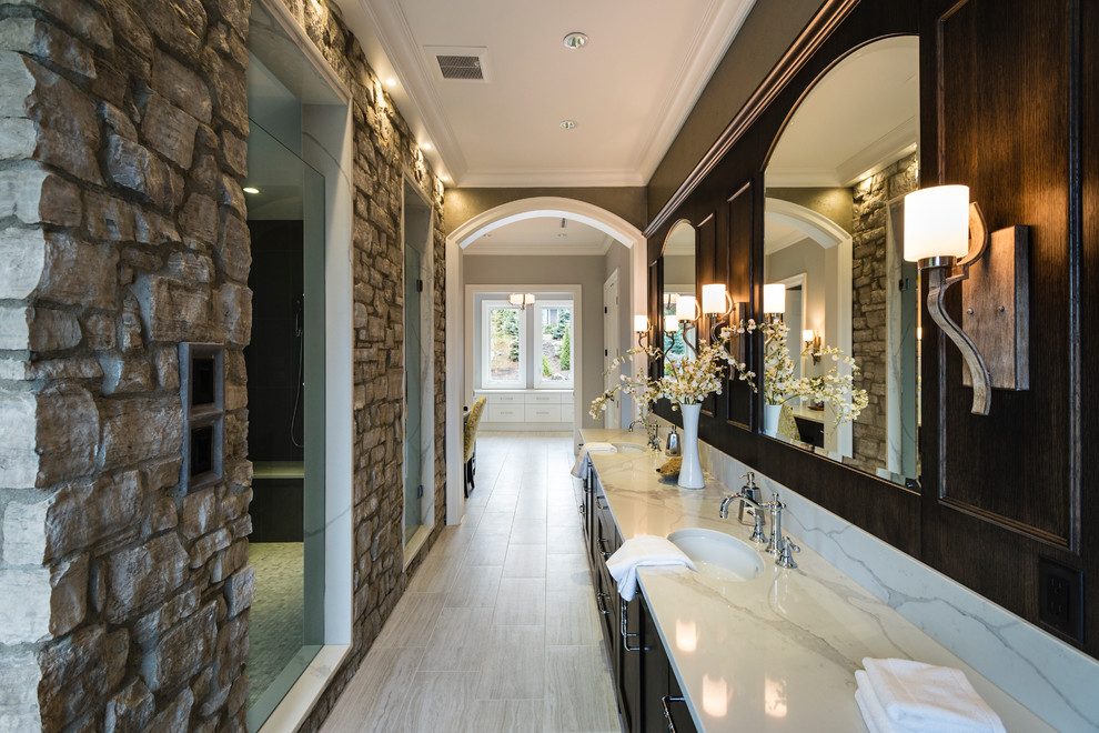 Freestanding bathtub - huge rustic master gray tile and stone tile porcelain tile and gray floor freestanding bathtub idea in Vancouver with shaker cabinets, dark wood cabinets, a two-piece toilet, gray walls, an undermount sink, solid surface countertops, a hinged shower door and white countertops