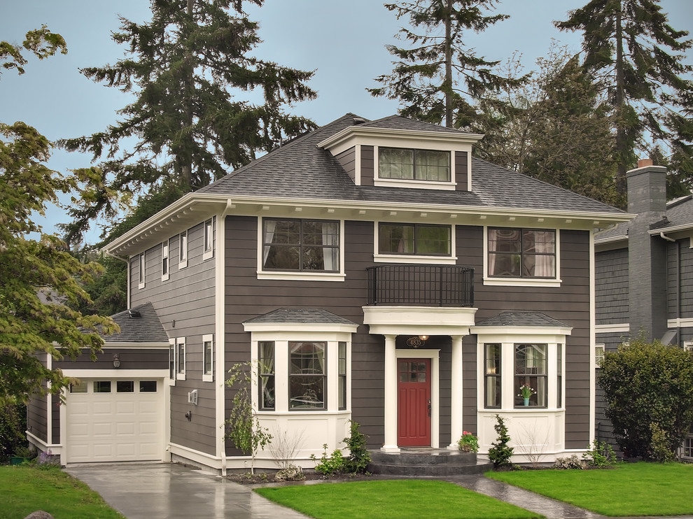 Inspiration for a mid-sized traditional three-storey exterior in Seattle with wood siding.
