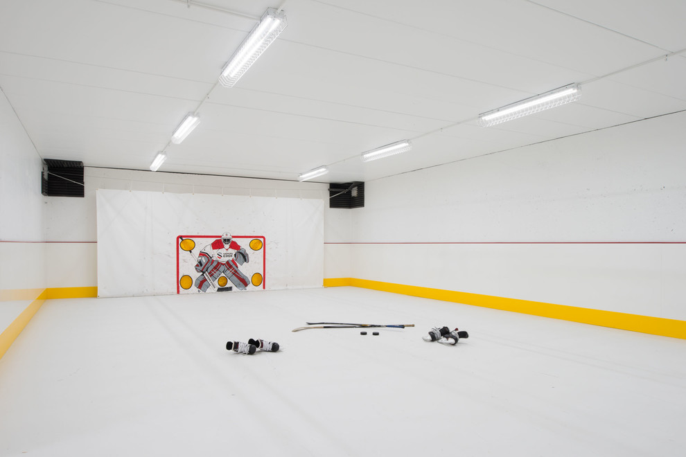 Contemporary indoor sport court in Minneapolis with white walls and white floor.