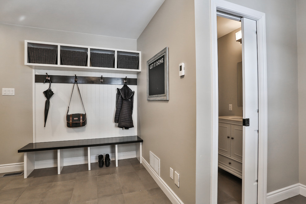 Mudroom - mid-sized transitional porcelain tile mudroom idea in Toronto