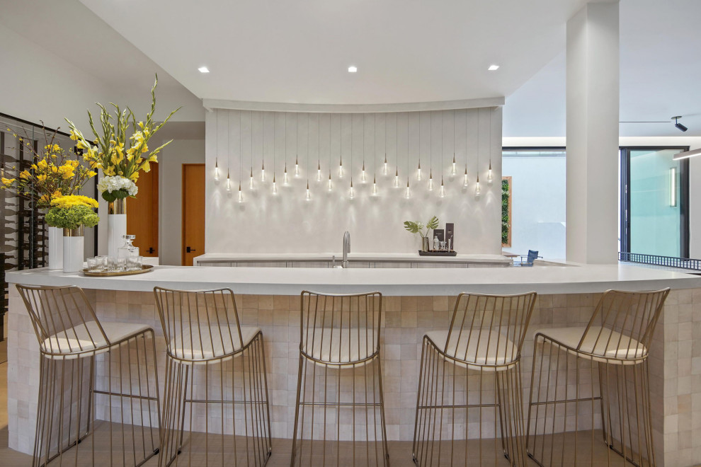 Large contemporary home bar in Los Angeles with light hardwood flooring.